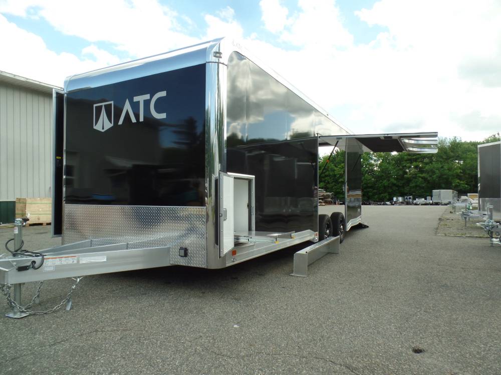 ATC top of the line RM550 series enclosed car trailer, with big escape door, finished interior, electrical package, cabinets.